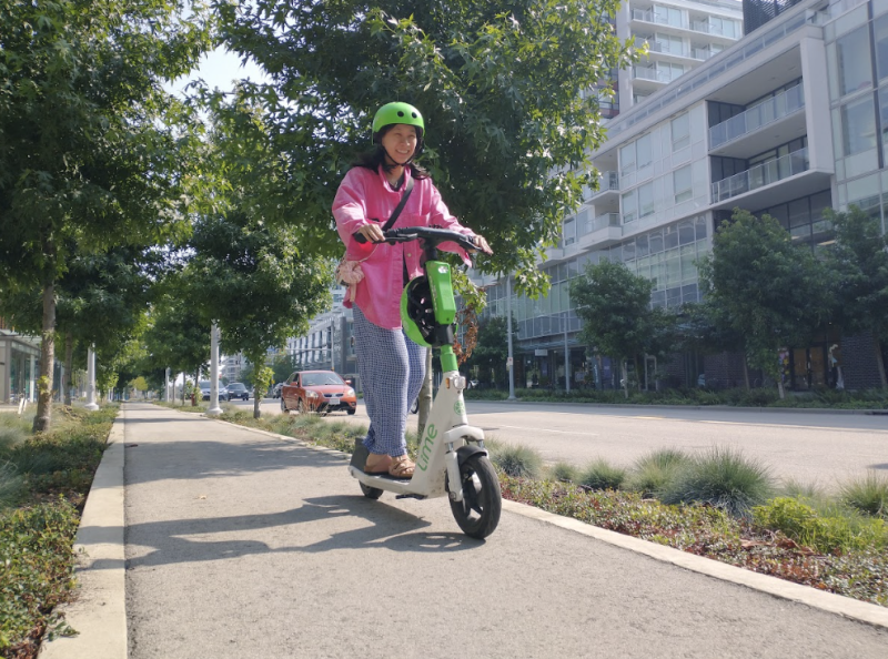 A person riding an e-scooter.