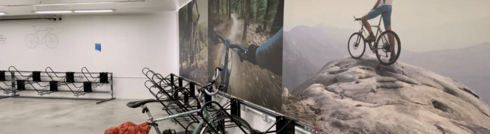 A bike is parked in an indoor bike room.