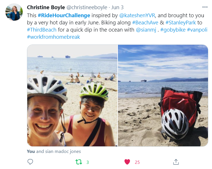 Two women wearing helmets smile after they biked to the beach