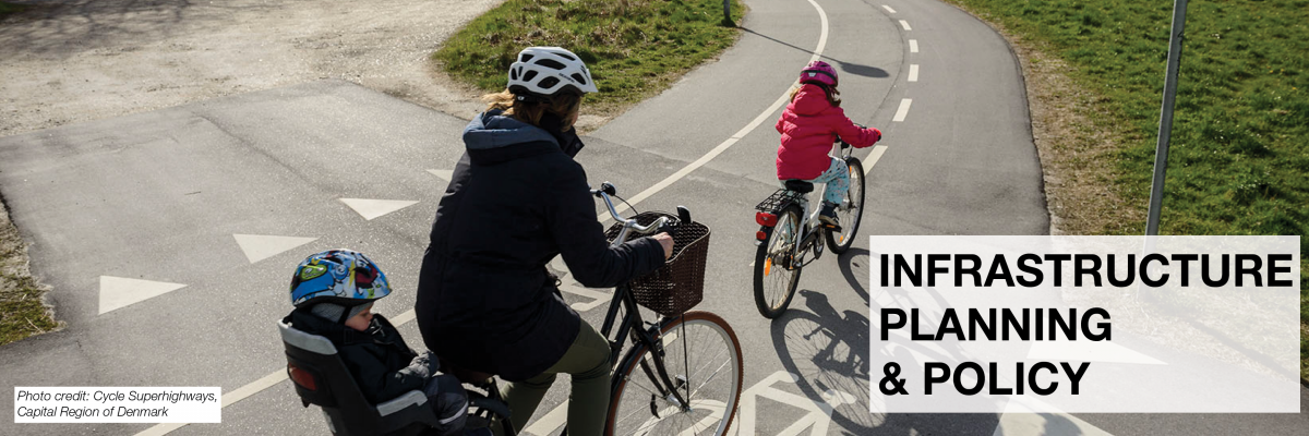 Infrastructure Planning & Policy. A woman and her two children ride along a cycle highway