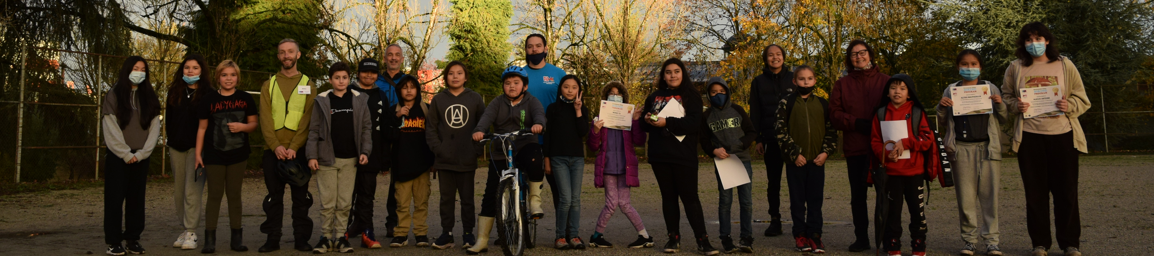 A group photo of students and instructors from Red Fox Healthy Living Society at a Ride Your Path Program graduation ceremony.