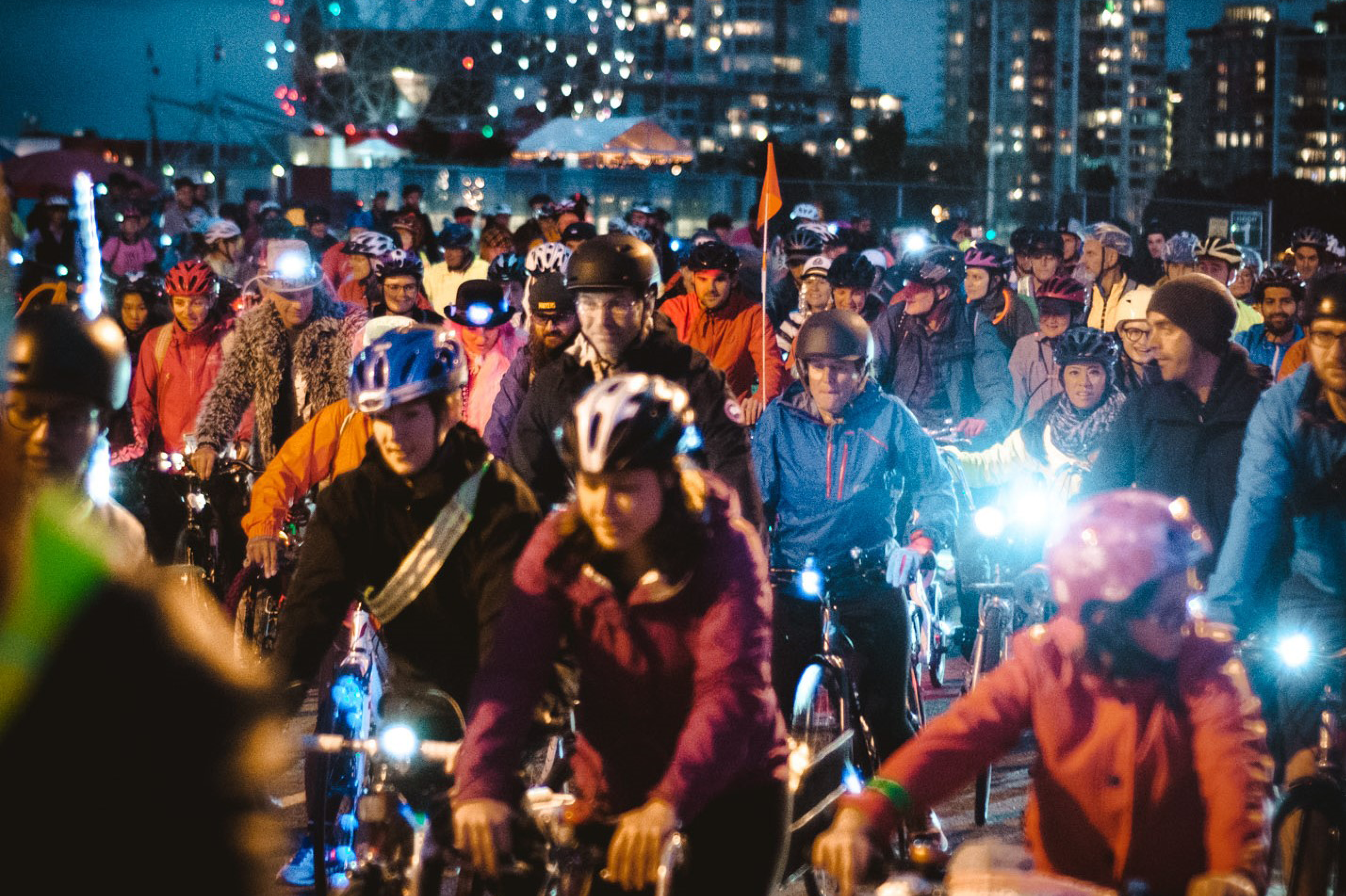 A group of people ride their bikes at HUB Cycling's Bike the Night event. This photo was taken by Simon Yoon.