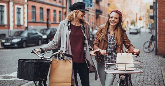 Women shopping by bike