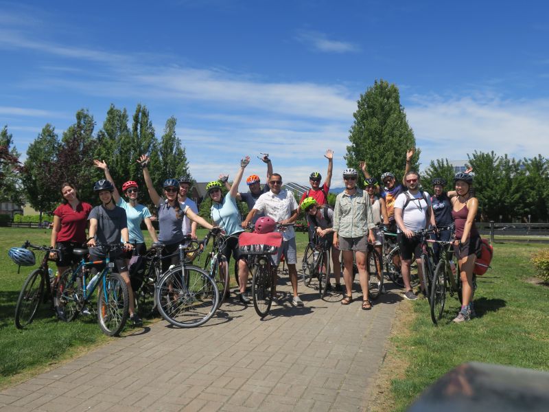A group photo of HUB Cycling's staff with their bikes at Osprey Village in Pitt Meadows.