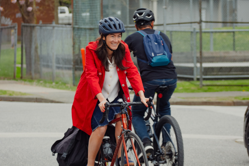 A young woman rides her bike in Vancouver.