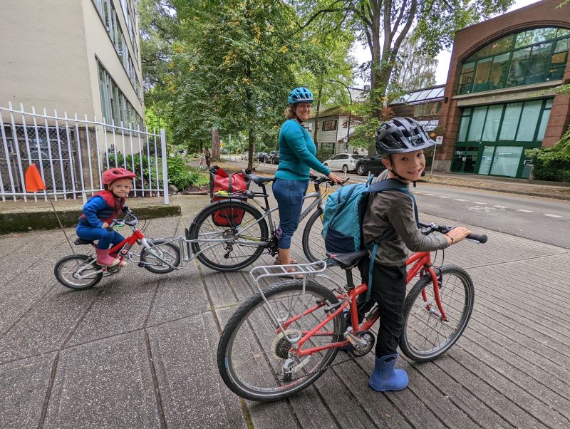 Maya Goldstein and her two sons prepare to ride to school.